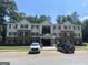 Two story apartment building with ample parking at 8201 Fairington Village Dr, Lithonia, GA 30038