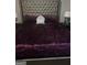Spacious bedroom with plush velvet bedding and a large headboard at 8201 Fairington Village Dr, Lithonia, GA 30038