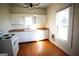Simple kitchen with white cabinets, wood floors, and a stove at 10 Maranatha Rd, Mcdonough, GA 30252
