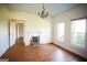 Spacious living room featuring hardwood floors, fireplace, and large windows at 10 Maranatha Rd, Mcdonough, GA 30252
