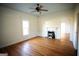 Bedroom with hardwood floors, fireplace, and window at 10 Maranatha Rd, Mcdonough, GA 30252