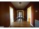 Long hallway with hardwood floors and doors at 10 Maranatha Rd, Mcdonough, GA 30252