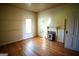 Bedroom with hardwood floors, fireplace, and window at 10 Maranatha Rd, Mcdonough, GA 30252