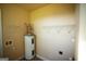 Laundry area with shelving and water heater at 10 Maranatha Rd, Mcdonough, GA 30252