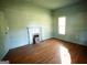 Bedroom with hardwood floors, fireplace, and window at 10 Maranatha Rd, Mcdonough, GA 30252