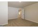 Bright bedroom with carpeted floor, door to another room, and neutral walls at 110 Jacoby Dr # 109, Fairburn, GA 30213