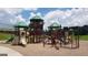 Community playground with playset, slides, and climbing structures at 104 Montgomery Dr, Stockbridge, GA 30281