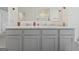 Double vanity with gray cabinets and a marble countertop at 104 Montgomery Dr, Stockbridge, GA 30281