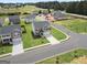 Aerial view of a new home community with several houses and open green spaces at 104 Montgomery Dr, Stockbridge, GA 30281