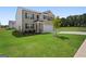 Two-story home with brick exterior and landscaping at 104 Montgomery Dr, Stockbridge, GA 30281