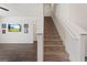 Modern staircase with carpeted steps and white railings at 104 Montgomery Dr, Stockbridge, GA 30281
