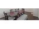 Dining room with a table, bench, and hardwood floors at 104 Montgomery Dr, Stockbridge, GA 30281