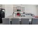 Modern kitchen with gray cabinets and granite countertops at 104 Montgomery Dr, Stockbridge, GA 30281