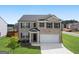 Two-story brick home with a two-car garage at 104 Montgomery Dr, Stockbridge, GA 30281