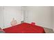 Spacious bedroom with red bedding and ample closet space at 104 Montgomery Dr, Stockbridge, GA 30281