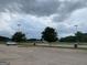 View of parking lot with athletic fields in the background at 104 Montgomery Dr, Stockbridge, GA 30281