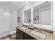 Modern bathroom with double vanity, granite countertop, and white subway tile at 3417 Sw Stonewall Dr # 87, Atlanta, GA 30349