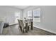 Bright dining area with glass table and chairs near French doors at 114 Jacoby Dr # 111, Fairburn, GA 30213
