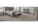 Spacious main bedroom with plush carpet and built-in bench at 114 Jacoby Dr # 111, Fairburn, GA 30213
