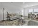 Bright living room with comfortable seating and dining area at 114 Jacoby Dr # 111, Fairburn, GA 30213