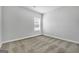Bright bedroom with neutral walls and carpeting at 114 Jacoby Dr # 111, Fairburn, GA 30213