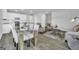 Open concept dining area with glass table and four chairs at 114 Jacoby Dr # 111, Fairburn, GA 30213
