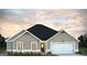 Modern ranch-style home with two-car garage at 114 Jacoby Dr # 111, Fairburn, GA 30213