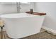 Relaxing freestanding bathtub with wooden bath tray at 114 Jacoby Dr # 111, Fairburn, GA 30213
