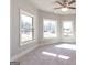 Charming bedroom with three windows and carpet at 230 Waltham Way, Fayetteville, GA 30214