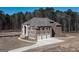 Brick home with a three-car garage and large yard at 230 Waltham Way, Fayetteville, GA 30214