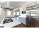 Modern kitchen island with stainless steel appliances and quartz countertops at 230 Waltham Way, Fayetteville, GA 30214