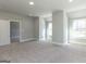 Well-lit bedroom with multiple windows and carpet at 230 Waltham Way, Fayetteville, GA 30214