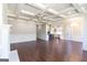 Open concept living room with kitchen view and hardwood floors at 230 Waltham Way, Fayetteville, GA 30214