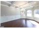 Elegant dining room with hardwood floors, crown molding, and large windows at 230 Waltham Way, Fayetteville, GA 30214