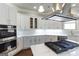 Spacious kitchen with stainless steel appliances and white cabinets at 230 Waltham Way, Fayetteville, GA 30214