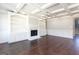 Living room with hardwood floors, fireplace, and coffered ceiling at 230 Waltham Way, Fayetteville, GA 30214