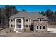 Brick house with a three-car garage at 230 Waltham Way, Fayetteville, GA 30214