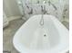 Relaxing oval soaking tub in a luxurious bathroom at 230 Waltham Way, Fayetteville, GA 30214