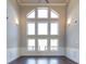 Gathering room featuring a stunning wall of windows and hardwood floors at 230 Waltham Way, Fayetteville, GA 30214