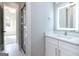 Bright bathroom with a walk-in shower, vanity with marble countertop, and LED mirror at 230 Waltham Way, Fayetteville, GA 30214