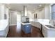 Modern kitchen boasting white cabinets, marble countertops, and stainless steel appliances at 230 Waltham Way, Fayetteville, GA 30214