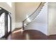 Grand entryway with curved staircase and hardwood floors at 230 Waltham Way, Fayetteville, GA 30214