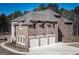 Brick home with a three car garage and large yard at 230 Waltham Way, Fayetteville, GA 30214