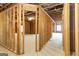 Unfinished basement framing with potential for various room layouts at 230 Waltham Way, Fayetteville, GA 30214