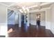 Open concept dining room with views to the kitchen and entryway at 230 Waltham Way, Fayetteville, GA 30214