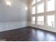 Spacious Gathering room with wall of windows and hardwood floors at 230 Waltham Way, Fayetteville, GA 30214