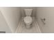 Simple toilet in a small, clean bathroom at 230 Waltham Way, Fayetteville, GA 30214