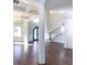 Bright and spacious entryway with hardwood floors and a grand staircase at 230 Waltham Way, Fayetteville, GA 30214