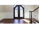 Grand entryway with curved staircase and hardwood floors at 230 Waltham Way, Fayetteville, GA 30214