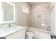 Bathroom with a bathtub, shower, and modern vanity with marble countertop at 230 Waltham Way, Fayetteville, GA 30214